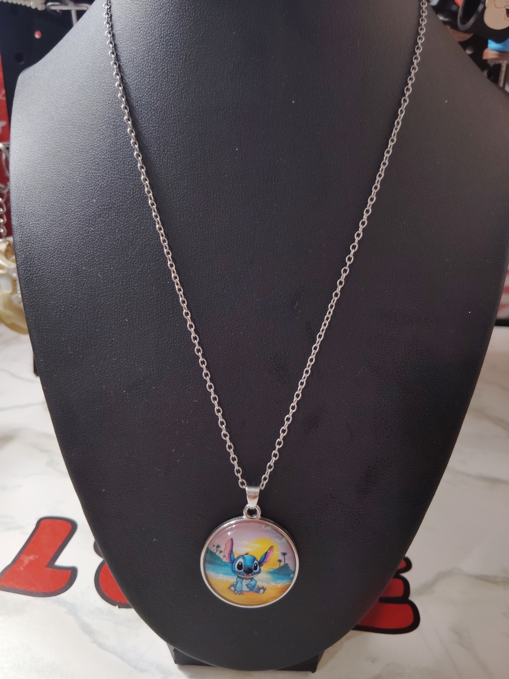 Silver-tone Blue Stitch Pendant Necklace